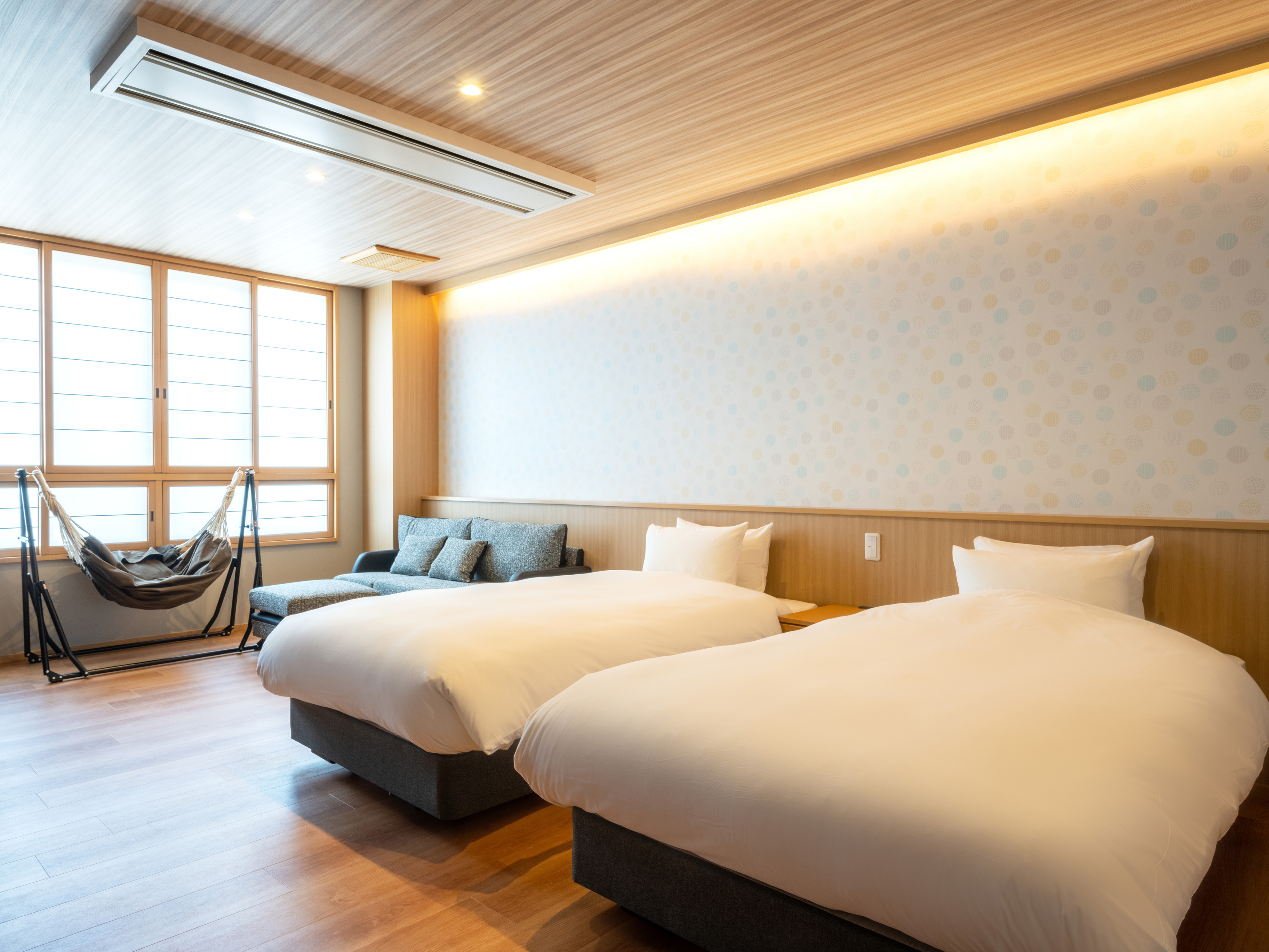 Una camera tranquilla con letti a Tofuya Ryokan